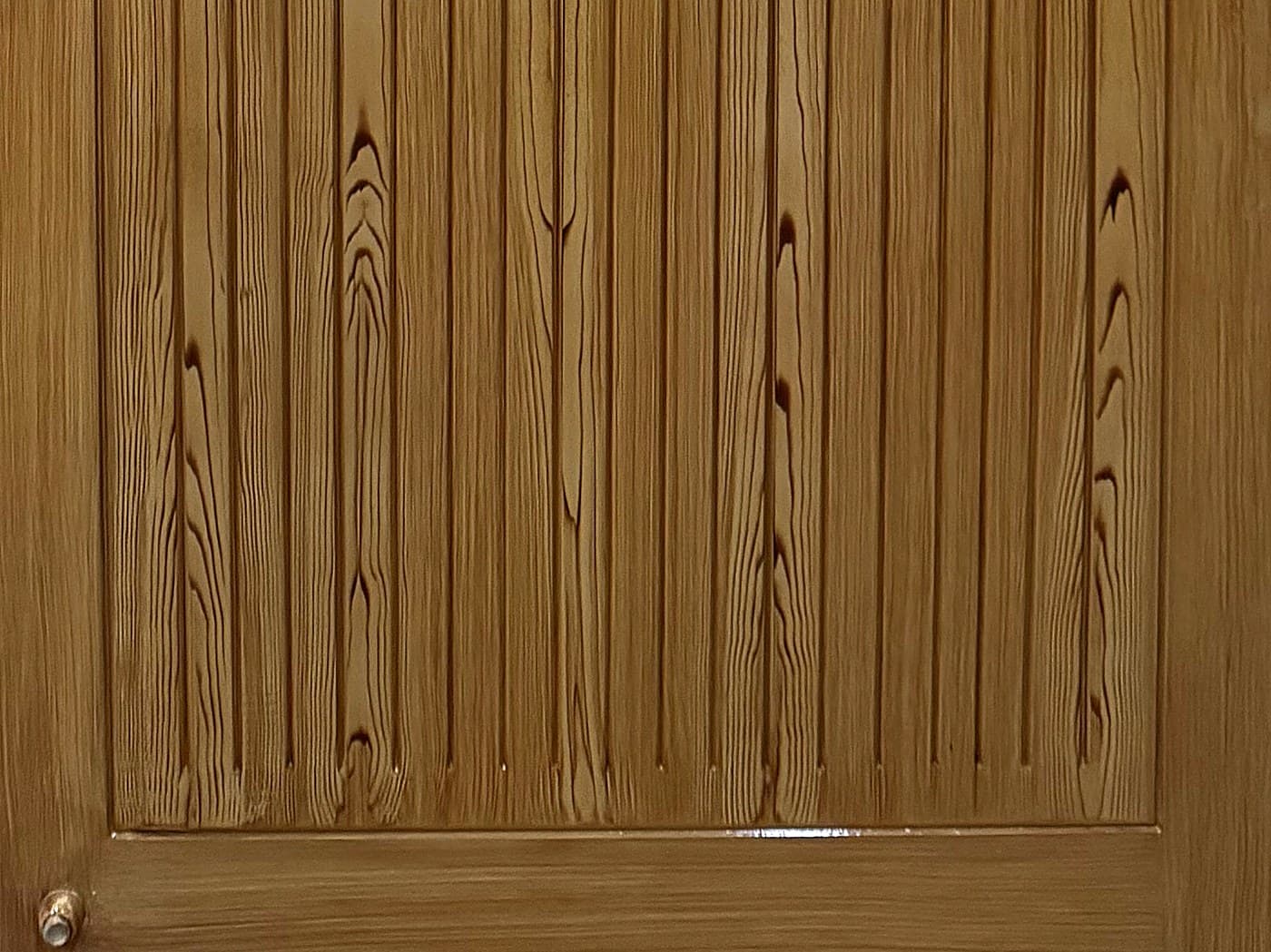 Fluted lower panel of a wooden door made and fitted in Okara.